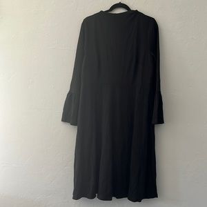 Plus size women’s Eloquii black dress with bell sleeves